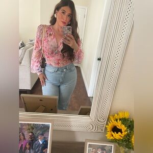 Floral bodysuit. Worn once, super stretchy . I’m 5’6 for reference.